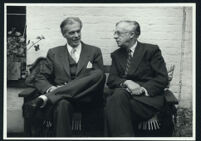 Aldous and Julian Huxley seated, talking (2) [descriptive]