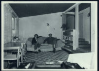 Aldous and Maria Huxley seated on a couch