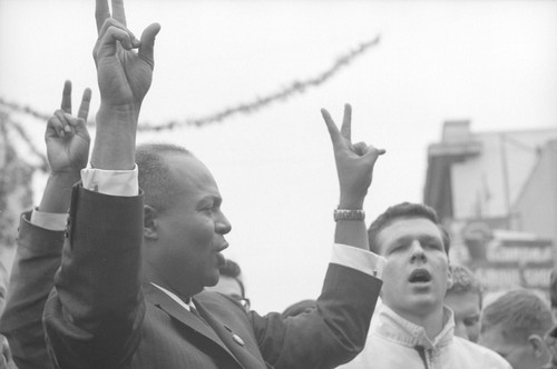 James Farmer giving the V sign at a CORE rally at Bancroft and Telegraph