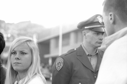 Student and Policeman at protest rally