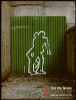 Poster of a silhouette on a green corrugated door of two people engaged in intercourse [descriptive]
