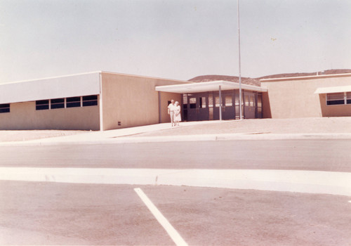 Susan B. Coombs and her husband, Robert H. Coombs, standing if front of the newly constructed Susan B. Coombs Intermediate School in Bannning, California