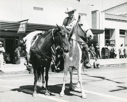 Two men on horses during parade along North San Gorgonio Avenue in Banning, California