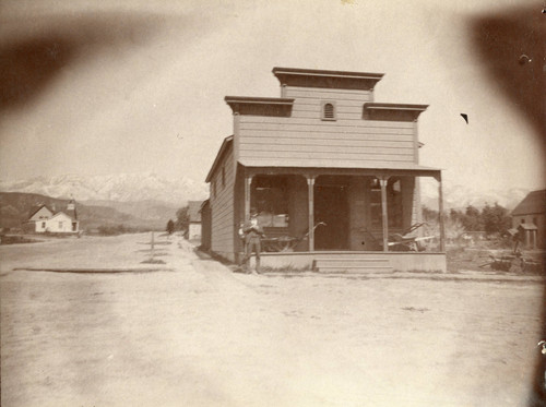Mounted photograph of the Reid Building in downtown Banning, California, which was located on the northeast corner of Livingston and San Gorgonio Avenue