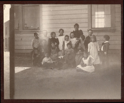 Mounted photograph of early Banning, California kidergarten class posing with teacher