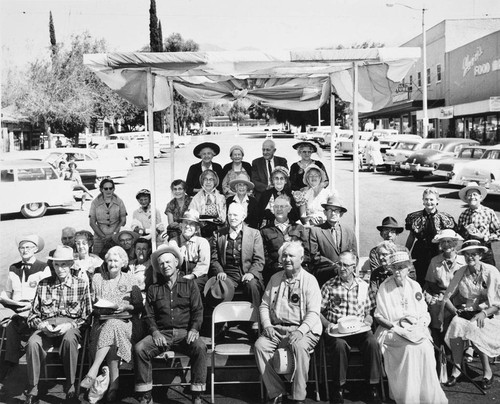 Pass Pioneers group on platform in front of First Street in Banning, California