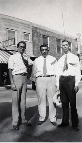 Three men posing on downtown Banning, California street during Colorado River Aqueduct celebration in 1931