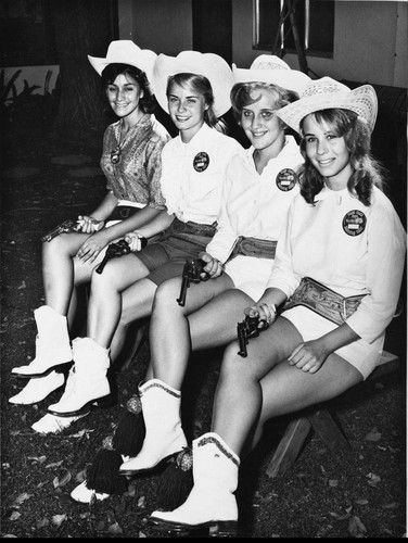Four young women in western outfits in the Stagecoach Days Celebration in Banning, California