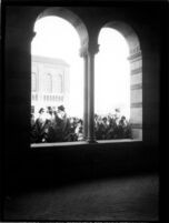 Royce Hall colonnade arches framing the Library (Powell Library), c.1936