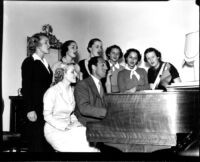 George Gershwin and students singing at the piano, 1937