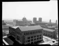 Aerial view of Chemistry Building (Haines Hall) with Library (Powell Library) and Royce Hall in background, 1930