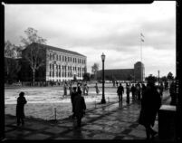 Snowfall on campus - Students moving between classes on Esplanade, 1949