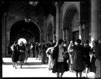 Registration - Students walking through Royce Hall colonnade, 1930