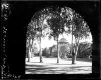 Vermont Avenue campus - Millspaugh Hall framed by North Hall arch, 1928