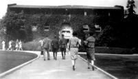 Vermont Avenue campus - Students walking toward the Women's Gymnasium, c.1928