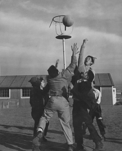 [Boys playing basketball at Granada incarceration camp]