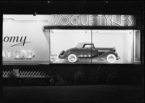 Vogue Tyres board with Hudson coupe, Southern California, 1935