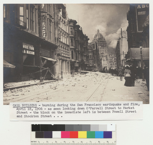 [verso:] Call Building on fire. Seen from O'Farrell St. [affixed caption:] Call Building--burning during the San Francisco earthquake and fire, April 18, 1906--as seen looking down O'Farrell Street to Market Street--the block on the immediate left is between Powell Street and Stockton Street. [No. 512.]