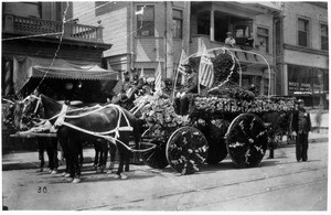 Firemen of Engine Company No. 30 riding a horse and buggy in the La Fiesta parade