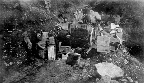 Railroad construction men with boxes in Feather River Canyon