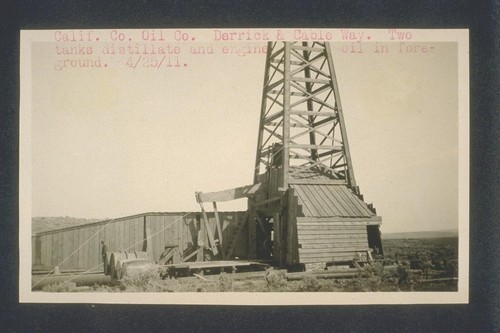 California Counties Oil Company derrick and cable way. Two tanks distillate and engine oil in foreground. April 25, 1911