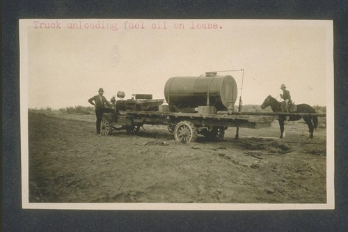 Truck unloading fuel oil on lease