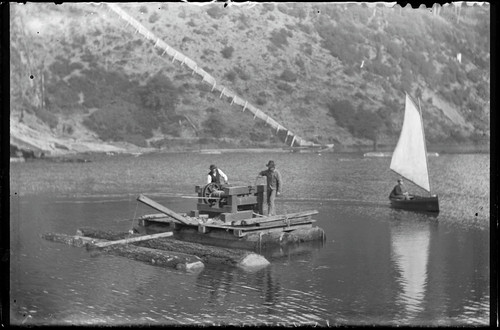 Log winch on raft. [negative]