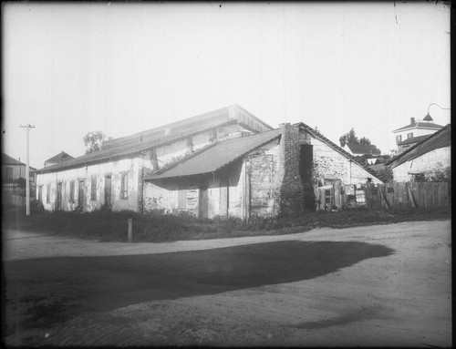 Abandoned building with sign, "Pure Drugs at Hilby's, Kodak Supplies, Stationery." [negative]