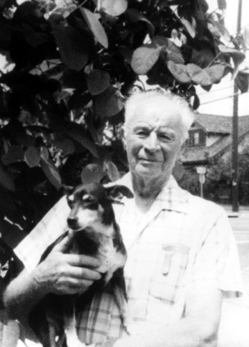 Laurence Pitcher holding his dog, Orange, California, 1979