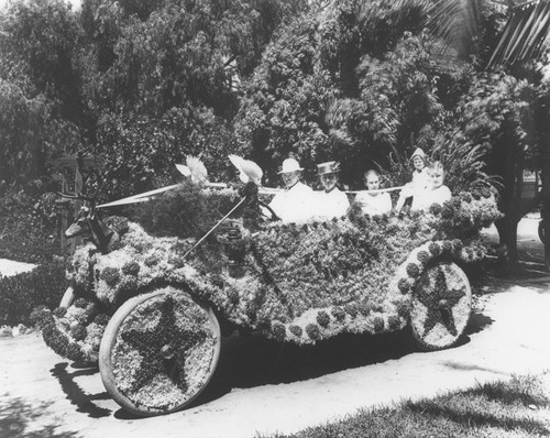 Woman's Club of Orange Flower Show Parade automobile covered with flowers, 1917