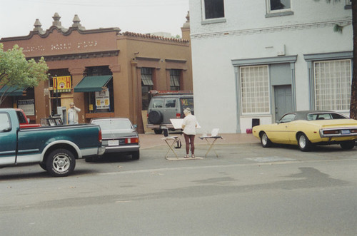 Plaza Square with artist painting, Orange, California, 1997