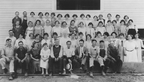 McPherson Heights Citrus Association Packing House employees posed outside for a group portrait in summer of 1924