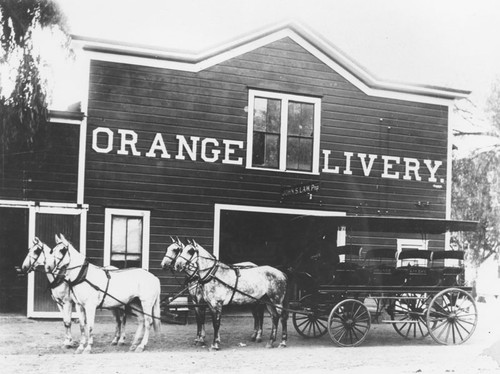 Orange Livery with four-horse omnibus, Orange, California, ca. 1907