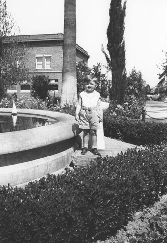 Wayne Scott Davis by fountain in Plaza Park, Orange, California, 1932