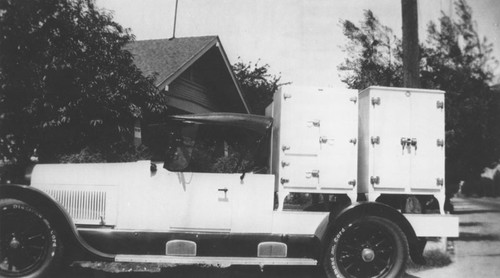 Orange Ice & Cold Storage Company delivery truck transporting ice boxes, Orange, California, ca. 1928