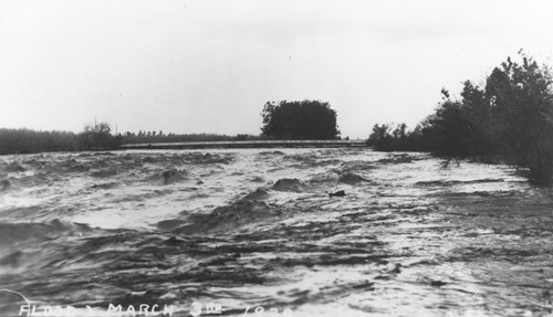 Bridge over Santa Ana River during flood, Orange, California, 1938