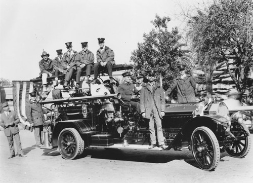 Orange Fire Department firemen pose with 1920 American-La France fire engine No. 1, Orange, California, 1922