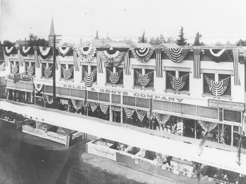 1910 Street Fair, view of decorated Ehlen & Grote Company building, Orange, California