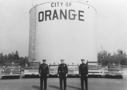 Orange water tank with Floyd Higgins, George Horton and Ed Quandt, Orange, California