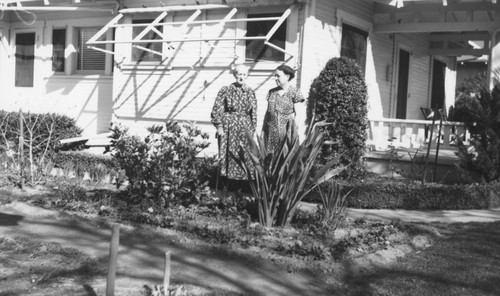 Mary Hillebrecht and grandmother, Margaretha Hillebrecht, in garden, ca. 1940