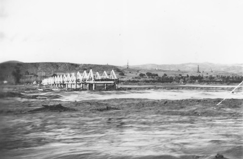 Yorba Bridge over Santa Ana River washed out by flood, Orange, California, 1938