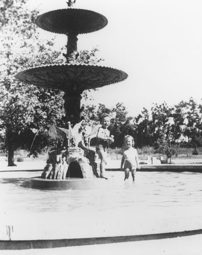 Fred Burnette and Luanne Easterly in the wading pool at W.O. Hart Park, 1941