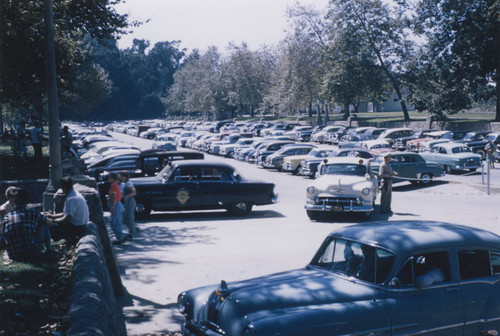 Orange Lionettes women's softball game parking lot in Orange City Park, Orange, California, 1954