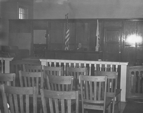 Judge Frank Hallman in Orange City Hall courtroom, Orange, California, ca. 1940