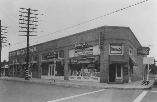 Olive Pharmacy, U.S. Post Office, and Olive Food Market, Olive, California, 1951