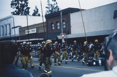 KLOS Radio's Mark and Brian "Day Before Thanksgiving" Parade with Orange Fire Department walking down South Glassell Street, Orange, California, 1995