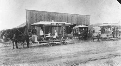 Orange streetcar "Orange Dummy" in front of streetcar stables, Santa Ana, California, 1889