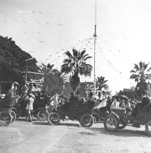 Plaza Square with automobile parade, Orange, California, ca. 1907