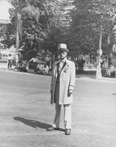 Unidentified man in Edwardian style parade costume, Orange, California, ca. 1960. (CHAIRMAN) IN COSTUME FOR PARADE