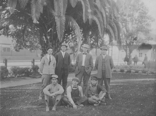 Santa Fe Depot employees in group portrait, Santa Fe Depot Park, Orange, California, 1912-1913